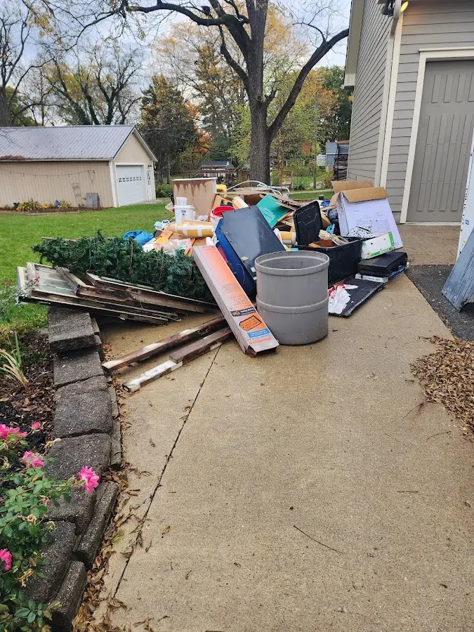 Dumpster being loaded with debris for 30 Yard Dumpster Rental in Waterloo